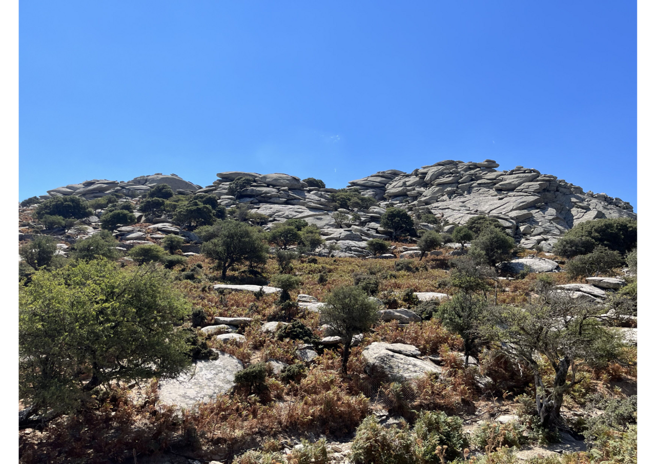 Traditional Ikarian village landscape with stone houses and mountain views