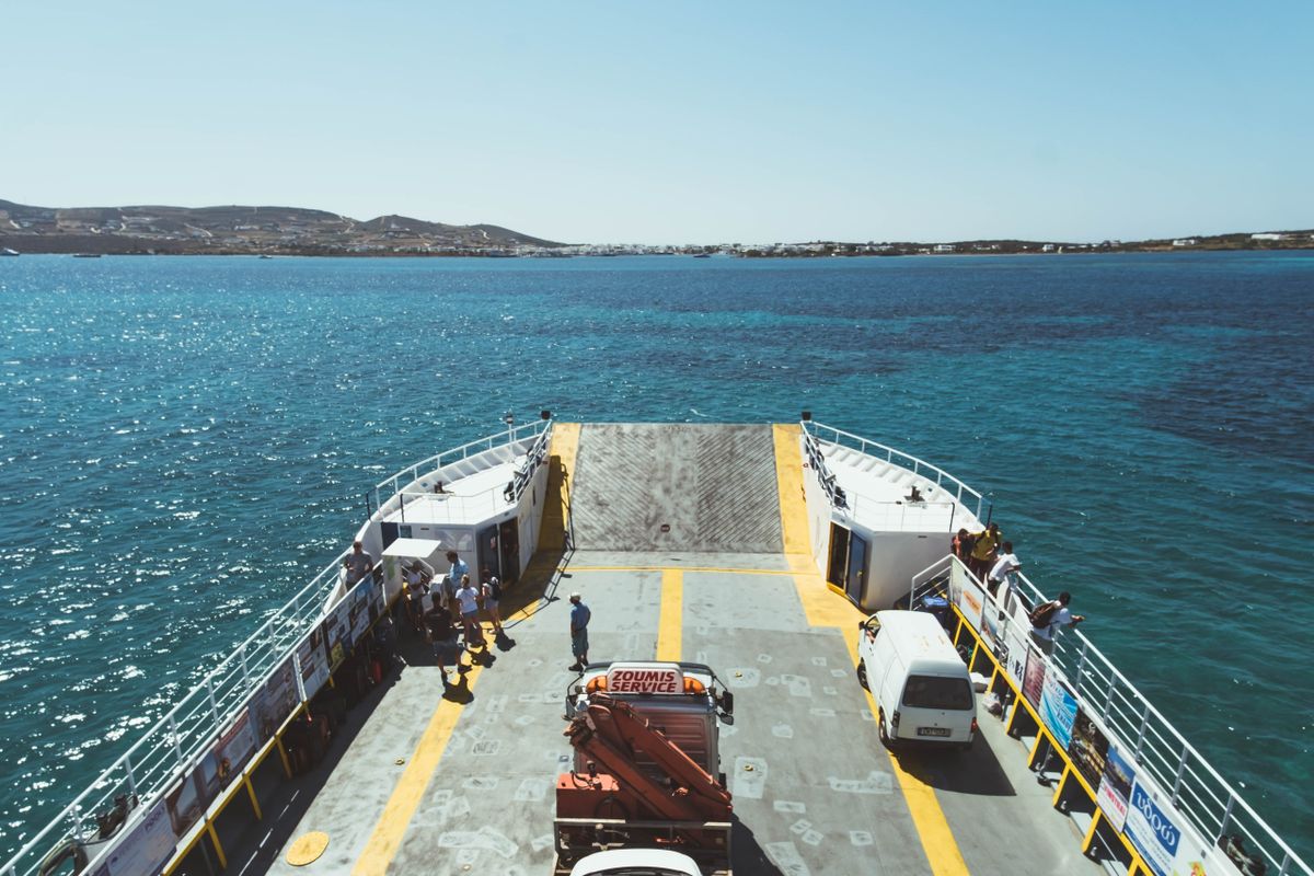 Passengers and vehicles on the deck of a modern Greek ferry crossing the Aegean
