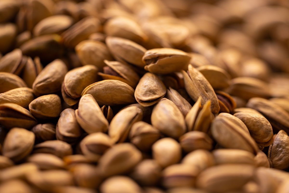 Close-up of fresh pistachio nuts at a market stall