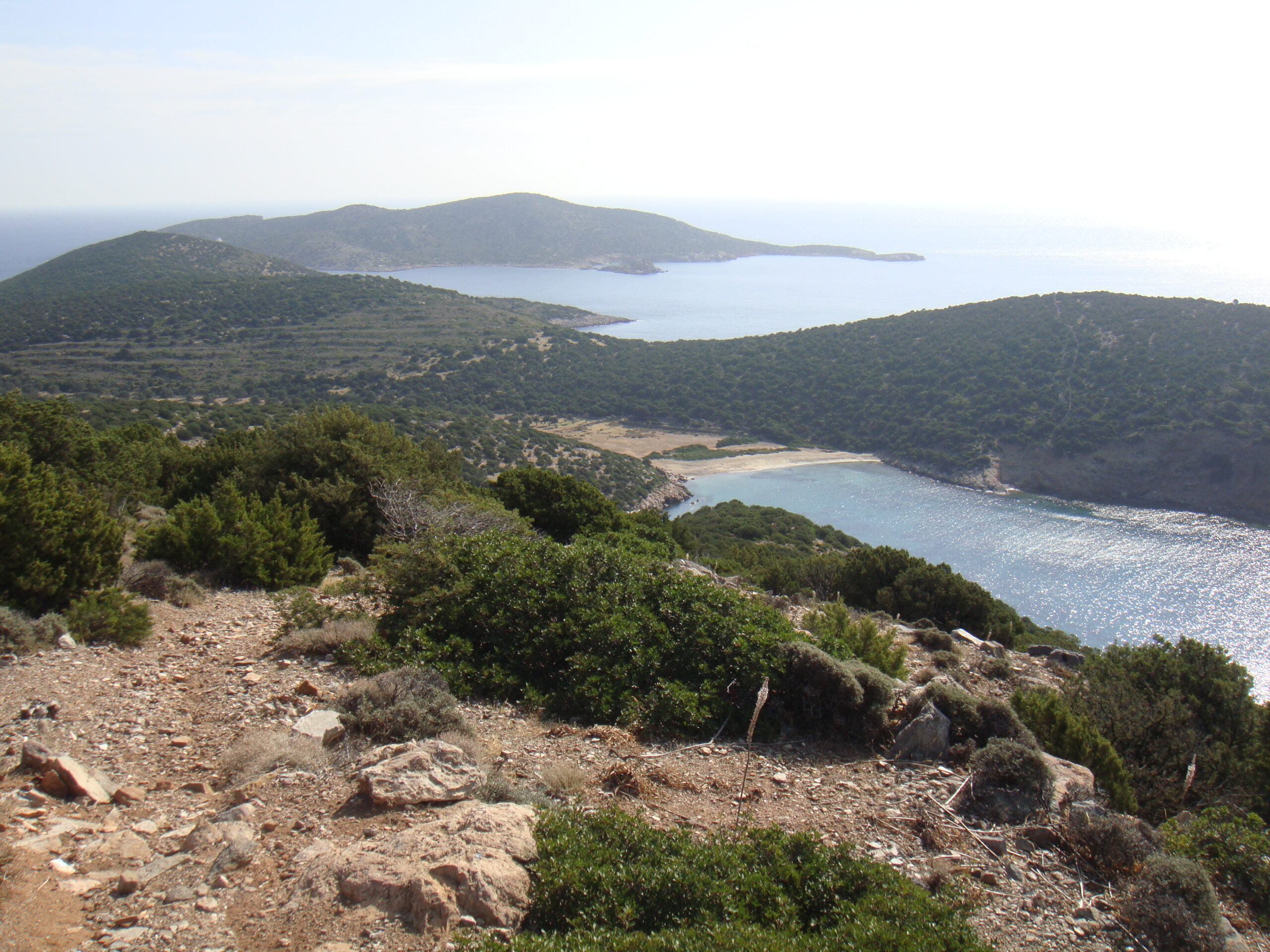 Fykiada Bay with turquoise water and the small uninhabited island of Kitriani, Sifnos, Greece