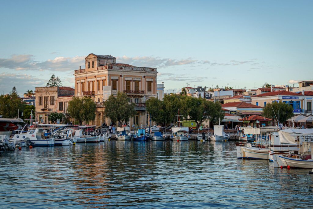 Aegina harbor marina with boats and neoclassical waterfront buildings, Saronic Islands Greece