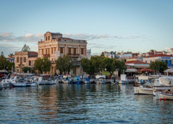 Aegina harbor marina with boats and neoclassical waterfront buildings, Saronic Islands Greece