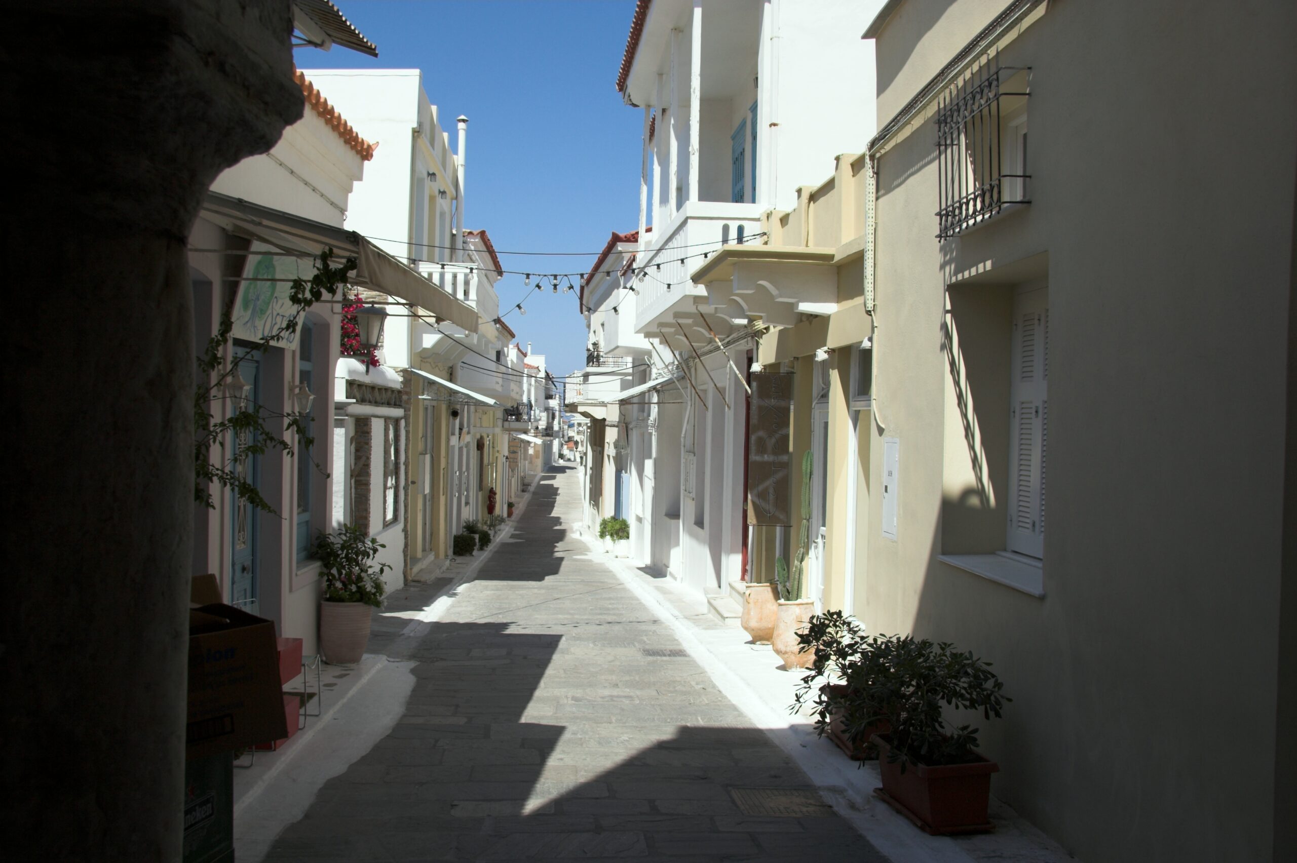 The elegant main street of Andros Chora old town, lined with neoclassical mansions