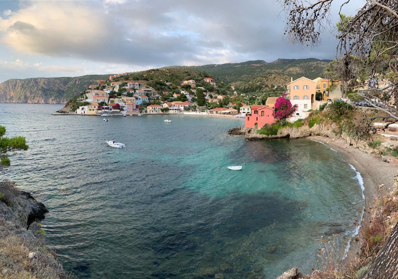 Colourful houses lining the waterfront of Asos village on Kefalonia in the Ionian Islands