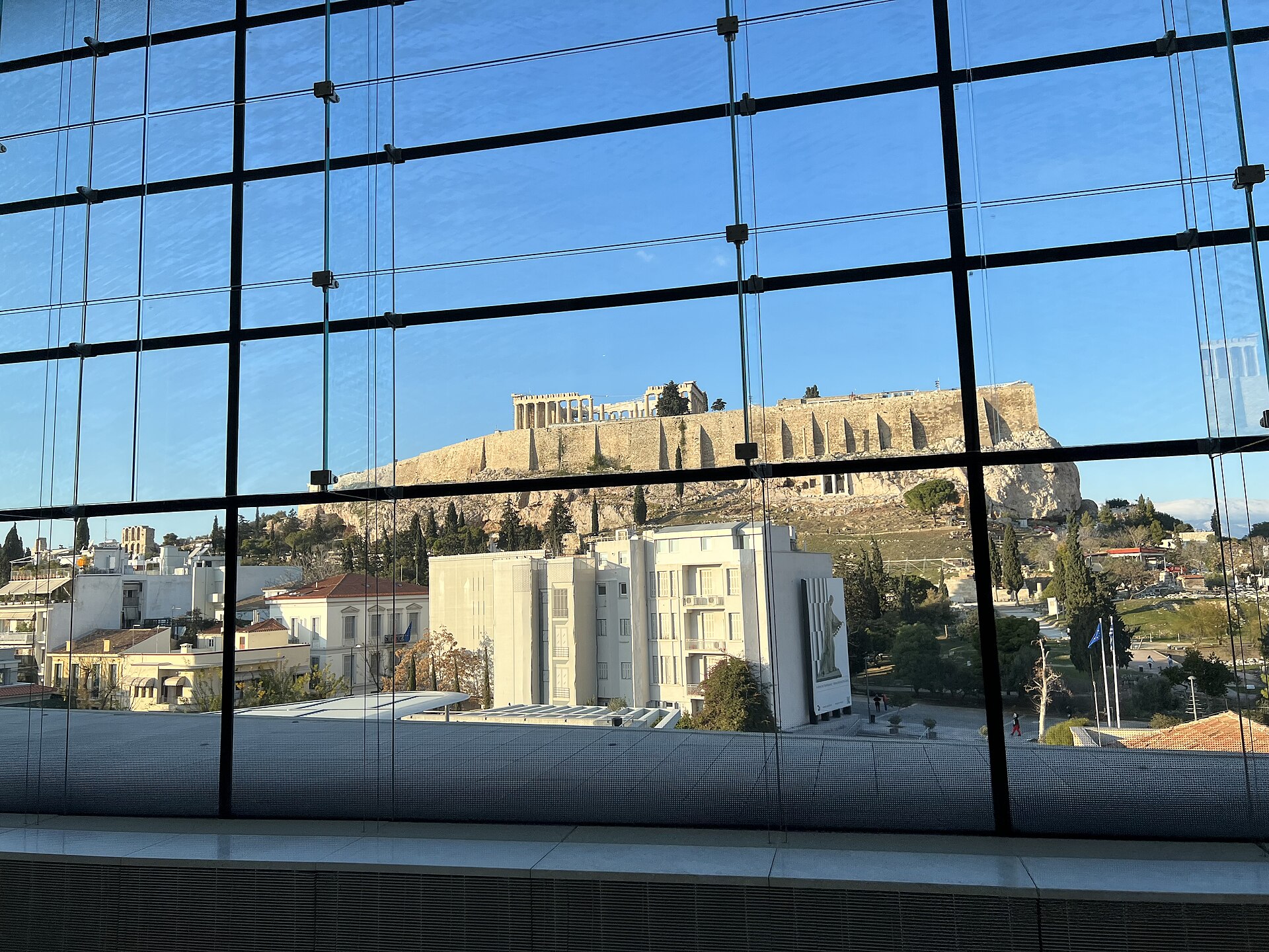 The Acropolis Museum in Athens with the Acropolis visible behind it
