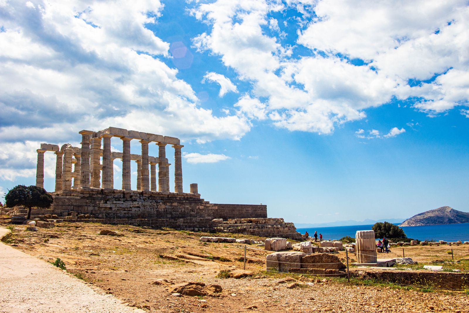 The Temple of Poseidon at Cape Sounion near Athens with its marble columns overlooking the blue Aegean Sea