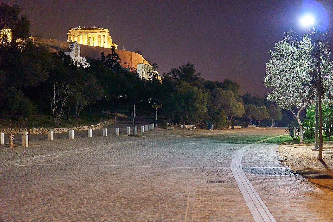 Dionysiou Areopagitou pedestrian street at night with the Acropolis behind