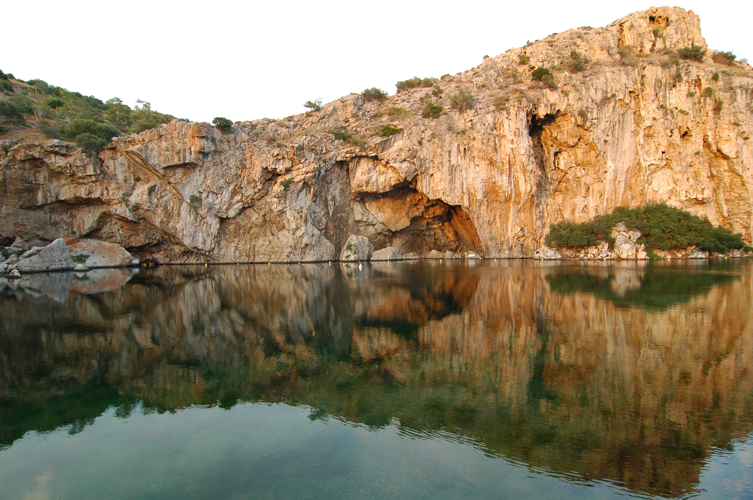 Lake Vouliagmeni beneath the limestone cliffs in southern Athens