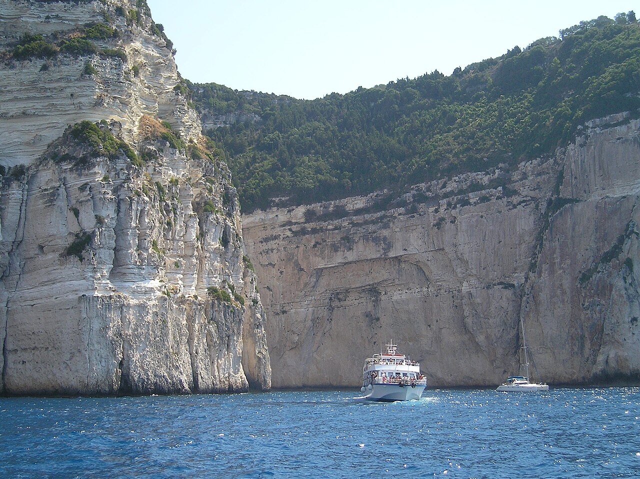 Vivid blue sea caves at Paxos Greece with clear turquoise water