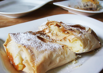 Bougatsa, a custard-filled phyllo pastry associated with Thessaloniki.