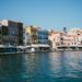Colourful Venetian-era buildings lining the waterfront of the Old Venetian Harbour in Chania, Crete