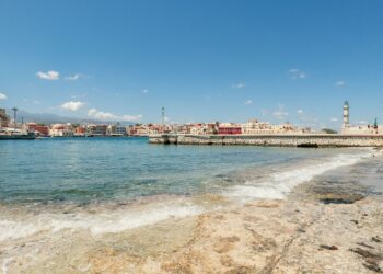 Chania Venetian Harbour with lighthouse at sunset, Crete Greece