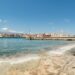 Chania Venetian Harbour with lighthouse at sunset, Crete Greece