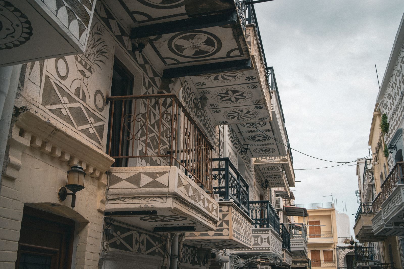 Geometric sgraffito patterns on building facades in Pyrgi, one of the medieval mastic villages of Chios