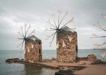 Stone windmills overlooking the Aegean Sea along the coast of Chios, Greece