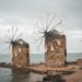 Stone windmills overlooking the Aegean Sea along the coast of Chios, Greece