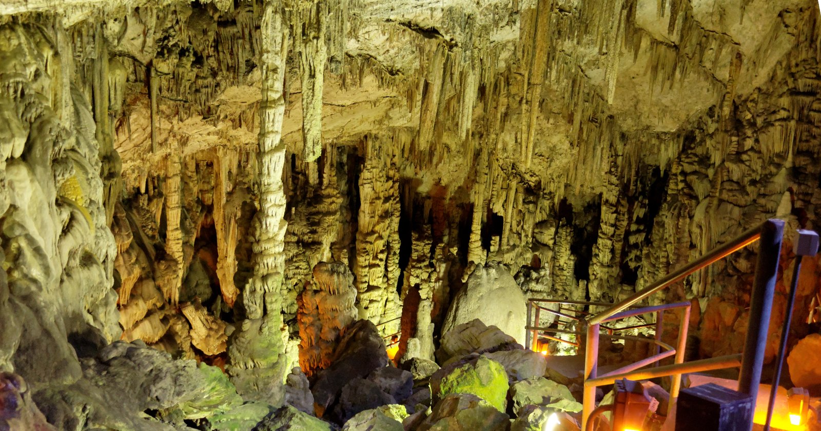 Stalactites, stalagmites and a lit visitor walkway inside Dikteon Cave near Psychro on the Lassithi Plateau.