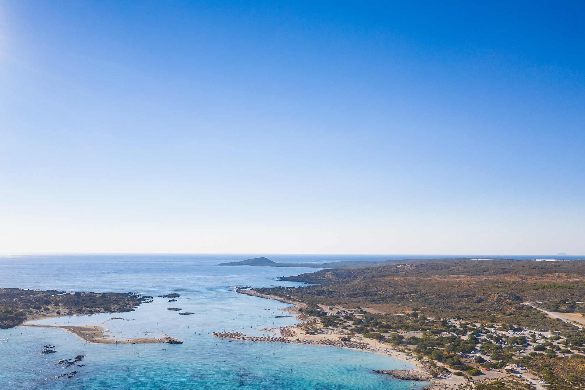 Aerial view across the shallow lagoon and low coastal scrub of Elafonisi in southwest Crete.