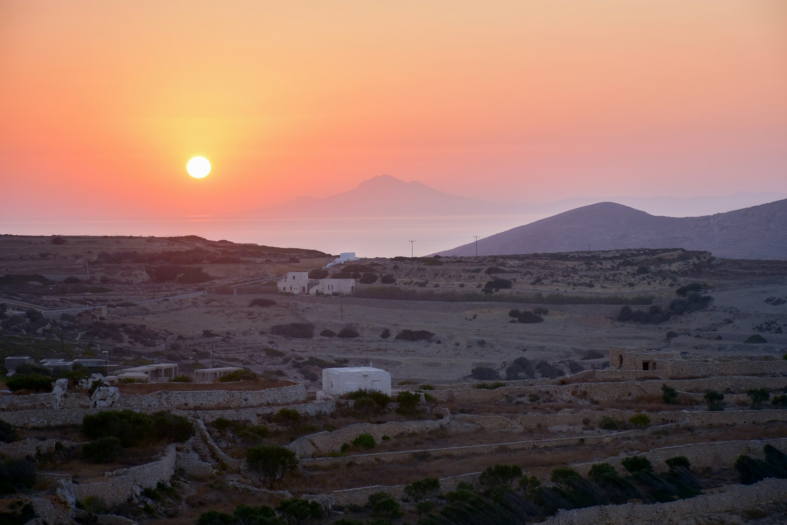 Aerial view of Folegandros showing Chora village and the surrounding Aegean coastline