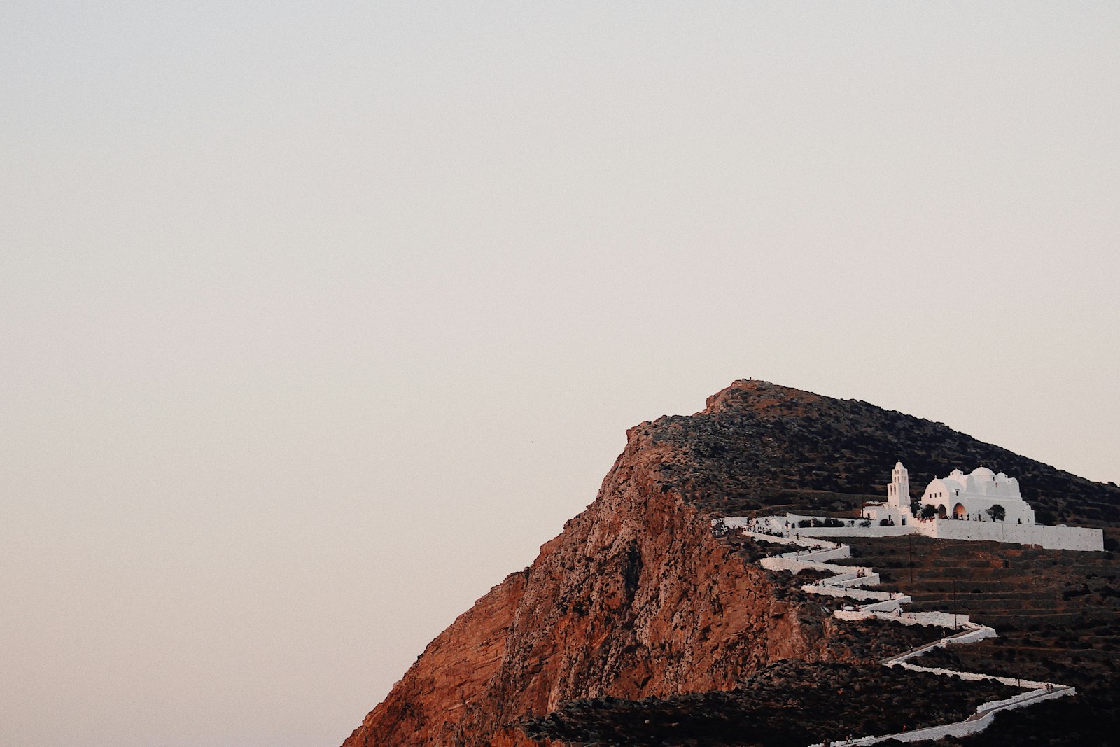 The Church of Panagia on its hilltop above Chora Folegandros with the Aegean Sea below