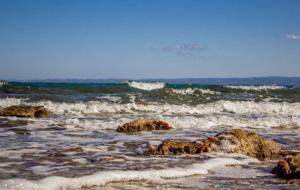 Waves on sandy beach at Hanioti on the Kassandra peninsula in Halkidiki Greece