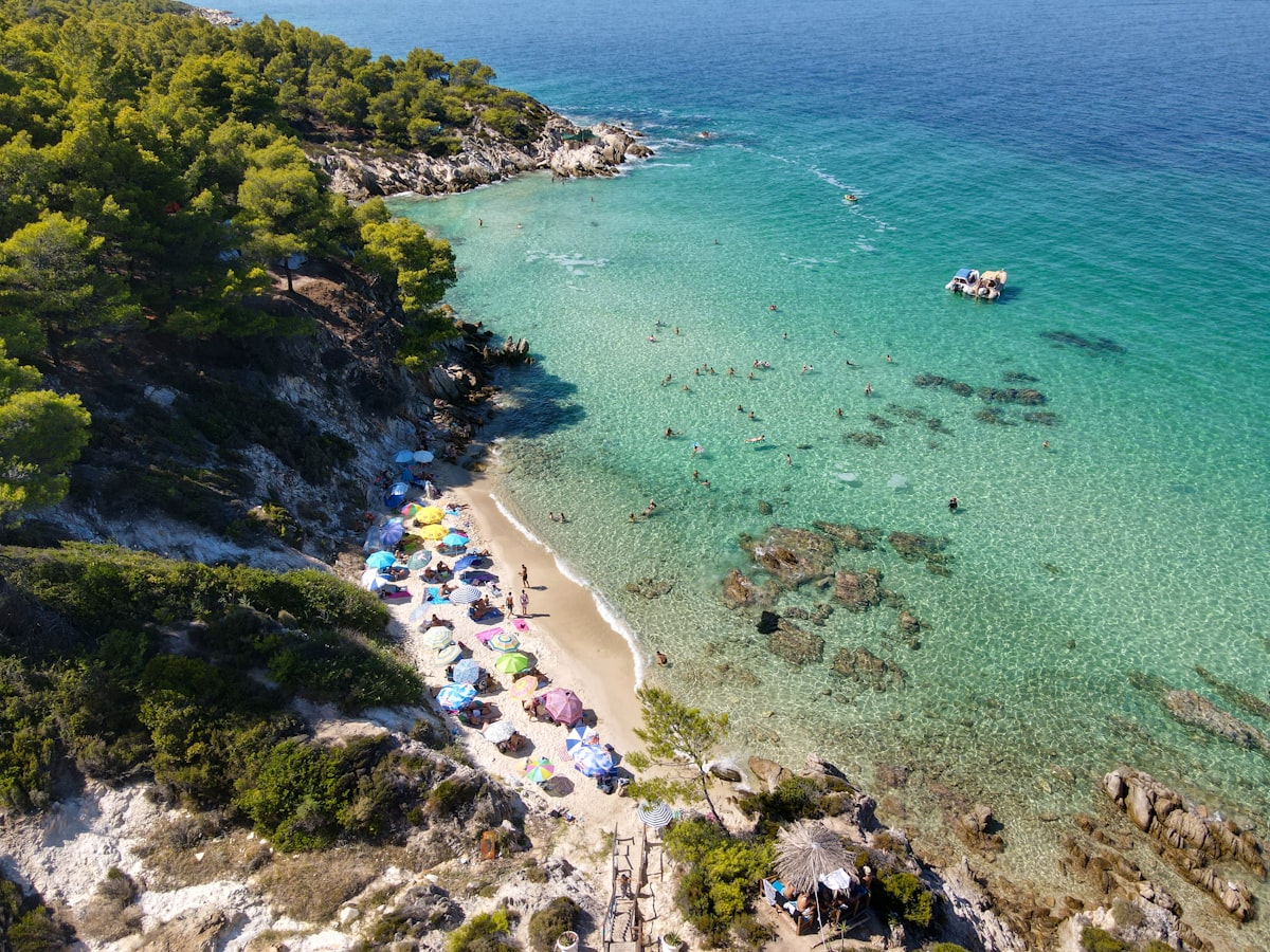 Aerial view of Kavourotrypes beach in Sithonia Halkidiki with turquoise coves and pine trees