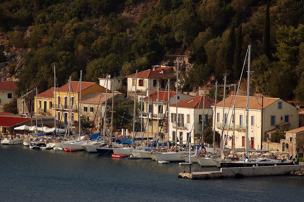 Kioni village harbor on Ithaka island with colorful boats and hillside houses