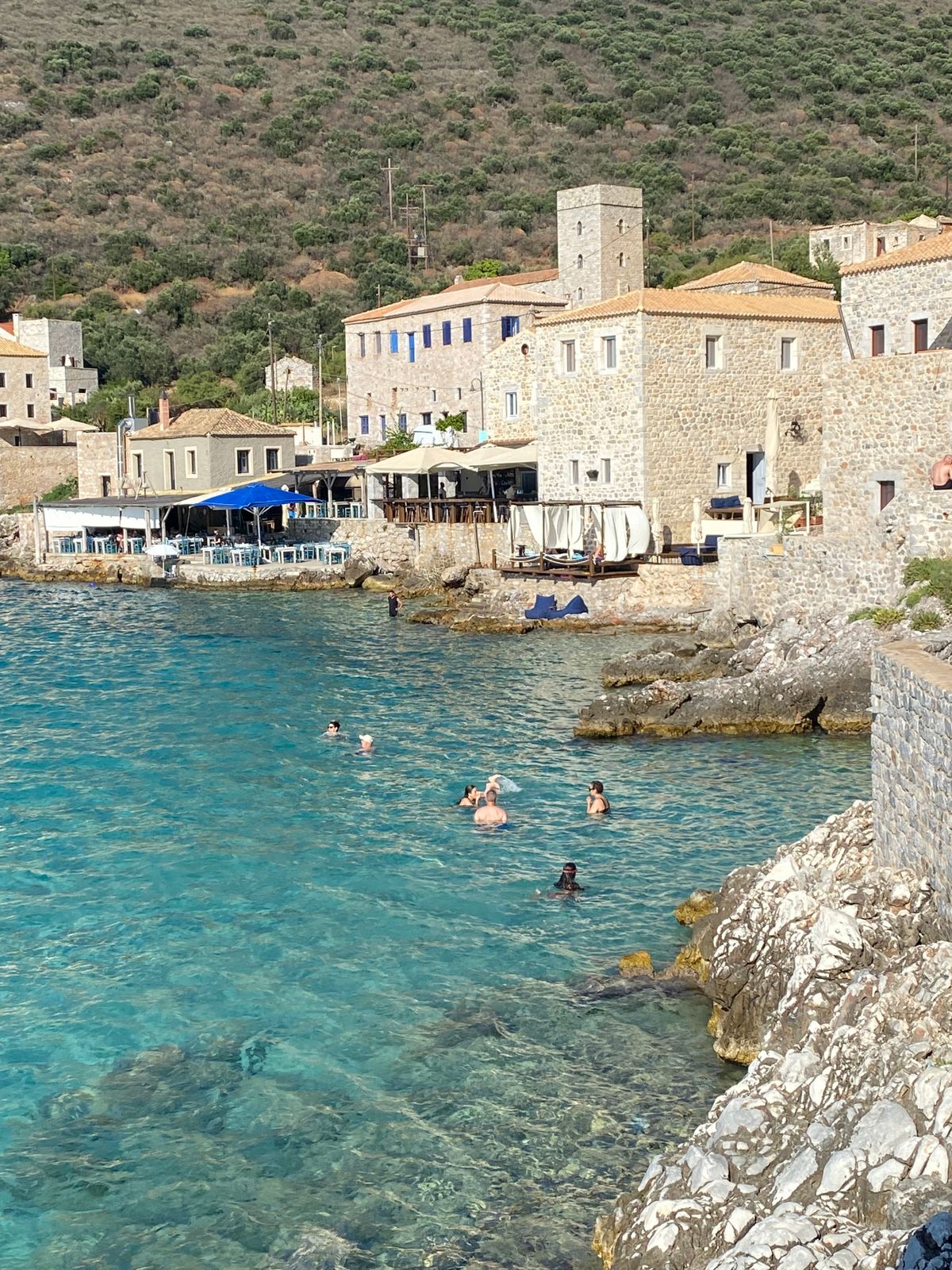 Coastal village of Limeni in the Mani Peninsula with crystal clear turquoise water and historic stone buildings