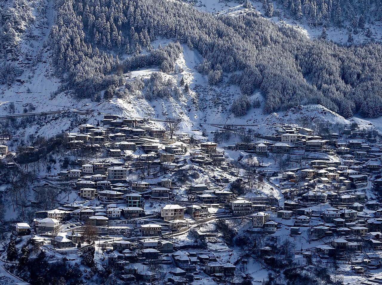 Snowy Metsovo town and surrounding mountain slopes