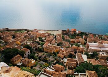 Aerial view of Monemvasia fortress rock connected to the Peloponnese mainland by a causeway