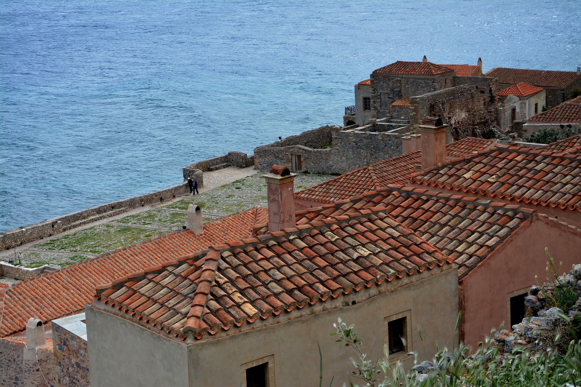 Terracotta rooftops of Monemvasia Lower Town against the backdrop of the Myrtoan Sea
