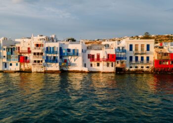 Sunset over the colourful waterfront buildings of Little Venice in Mykonos Town