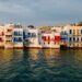 Sunset over the colourful waterfront buildings of Little Venice in Mykonos Town