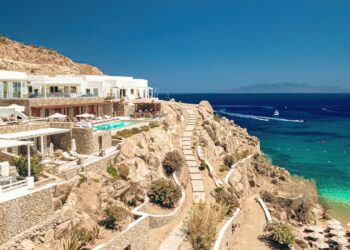 Sun loungers and turquoise water at Super Paradise Beach on the south coast of Mykonos