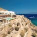 Sun loungers and turquoise water at Super Paradise Beach on the south coast of Mykonos