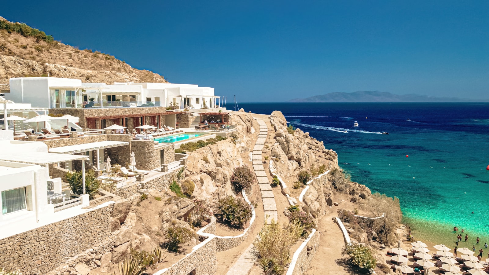 Sun loungers and turquoise water at Super Paradise Beach on the south coast of Mykonos