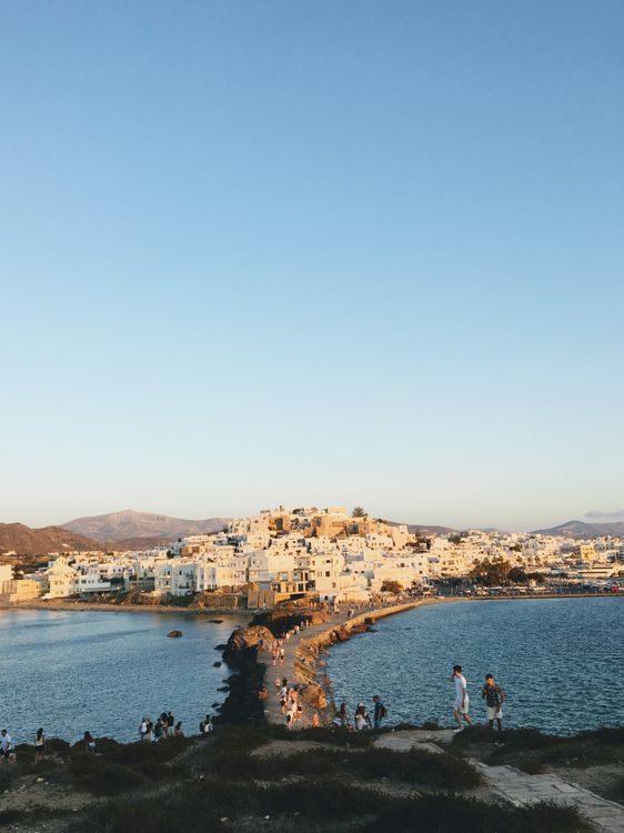 Aerial view of Naxos Town (Chora) at sunset showing whitewashed houses and the harbour