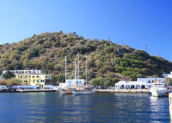 Harbour of Mandraki on Nisyros with white houses around the bay