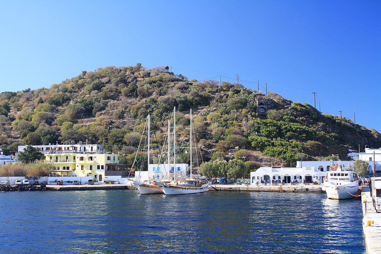 Harbour of Mandraki on Nisyros with white houses around the bay