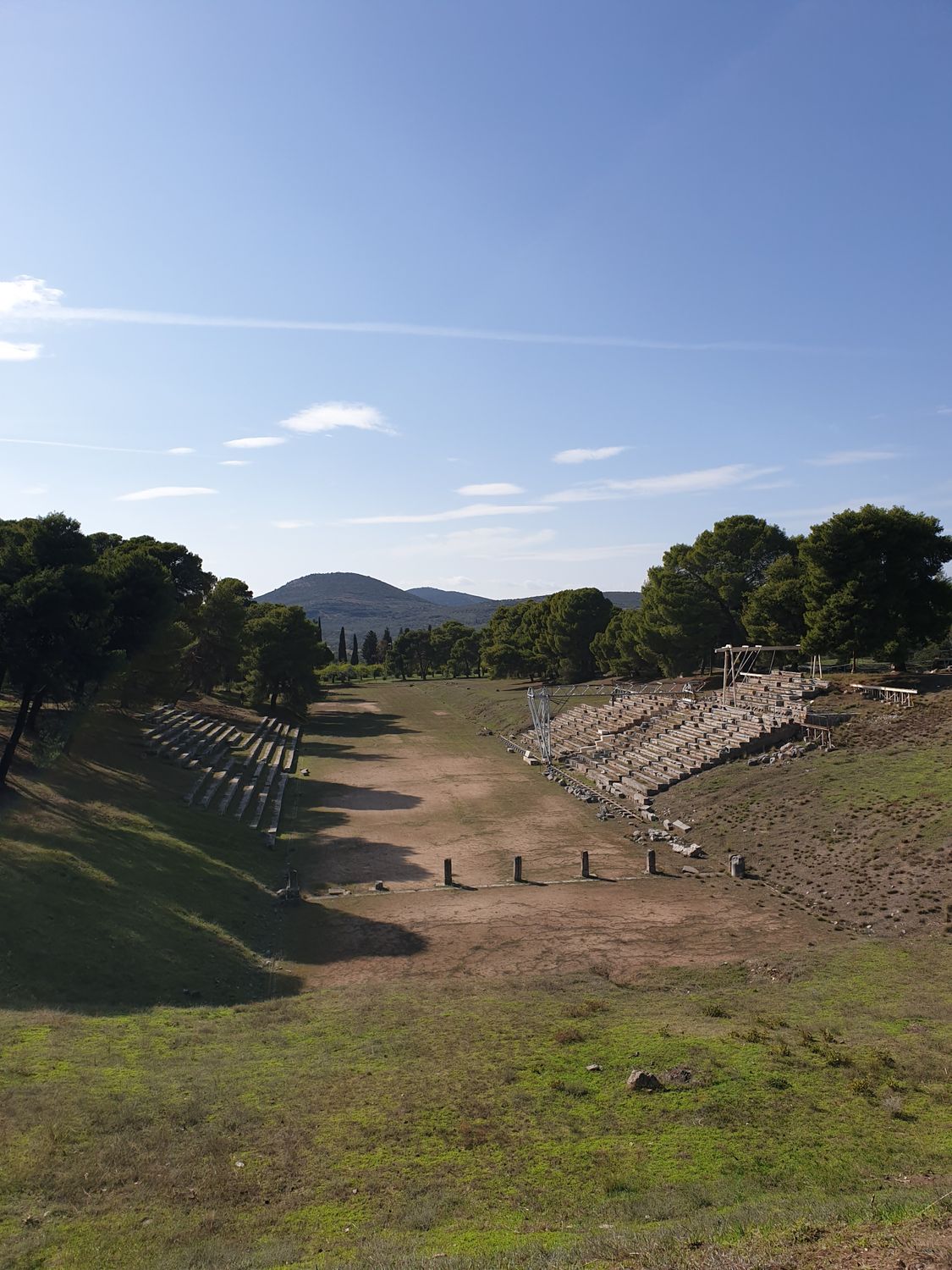 The ancient stadium at Olympia with stone entrance tunnel and running track