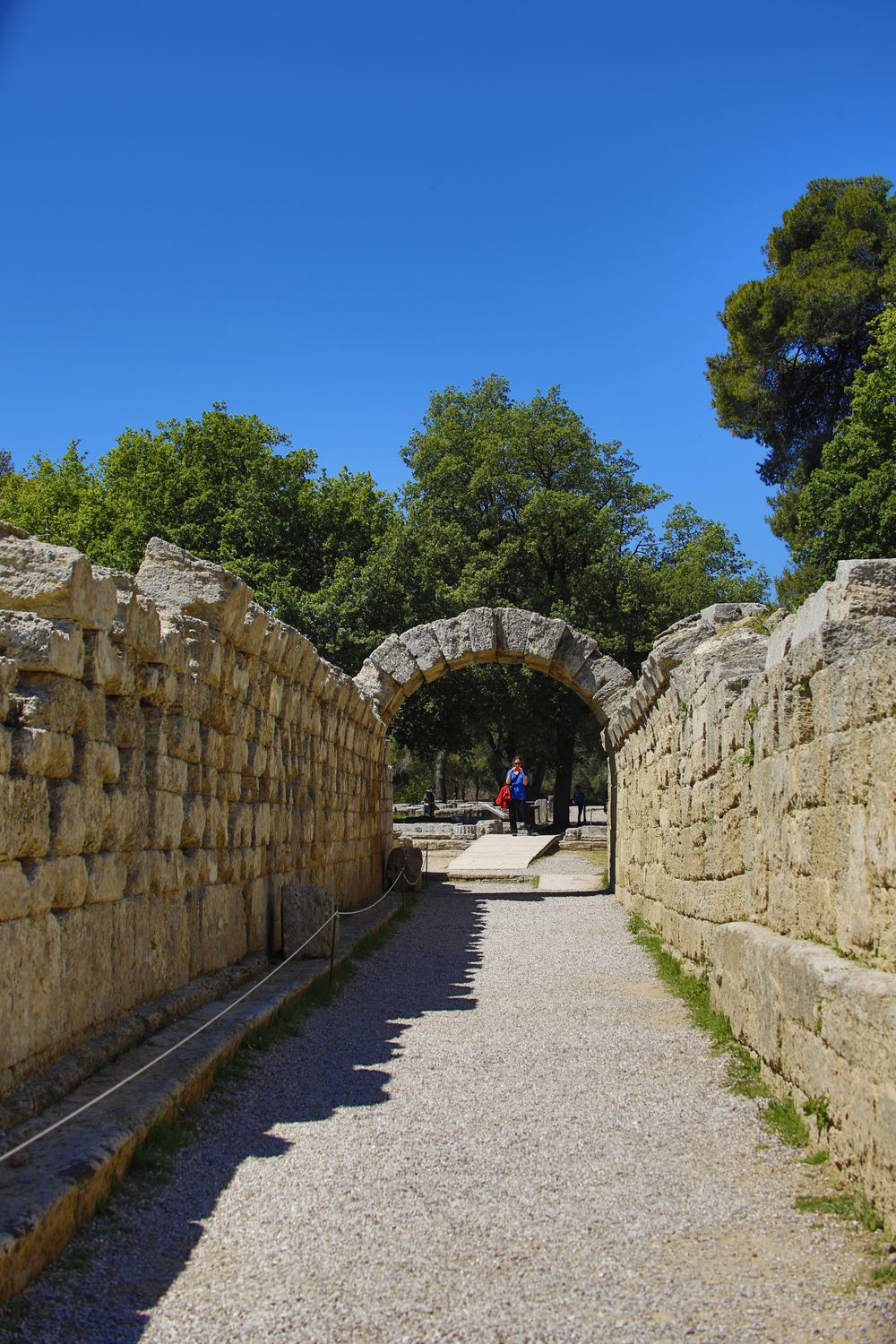 Stone archway entrance Krypte tunnel leading to the ancient stadium at Olympia