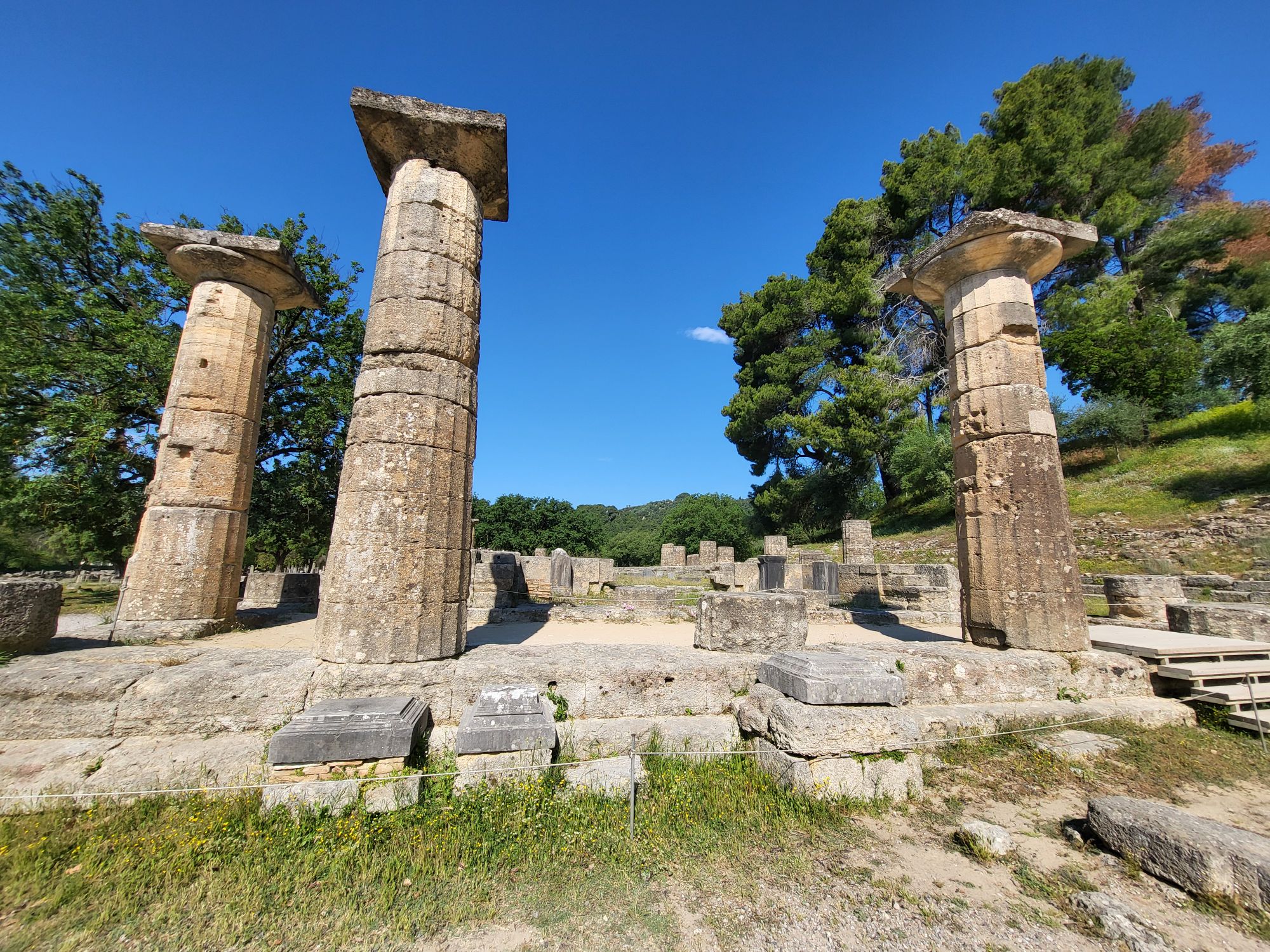 Ruins and fallen columns at the archaeological site of Ancient Olympia Greece