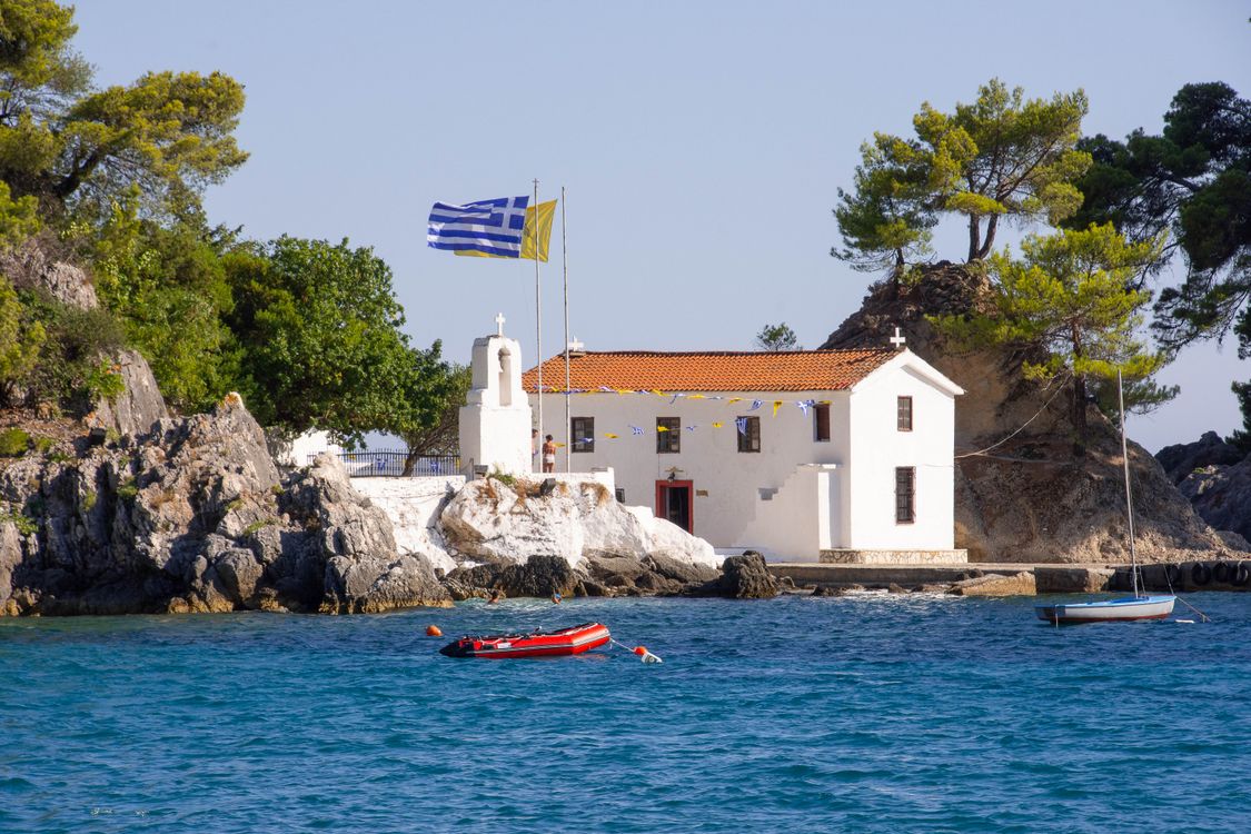 Greek Orthodox church perched on coastal cliffs above the sea near Parga
