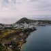 Aerial view of Patmos island coastline with traditional white buildings and blue Aegean Sea