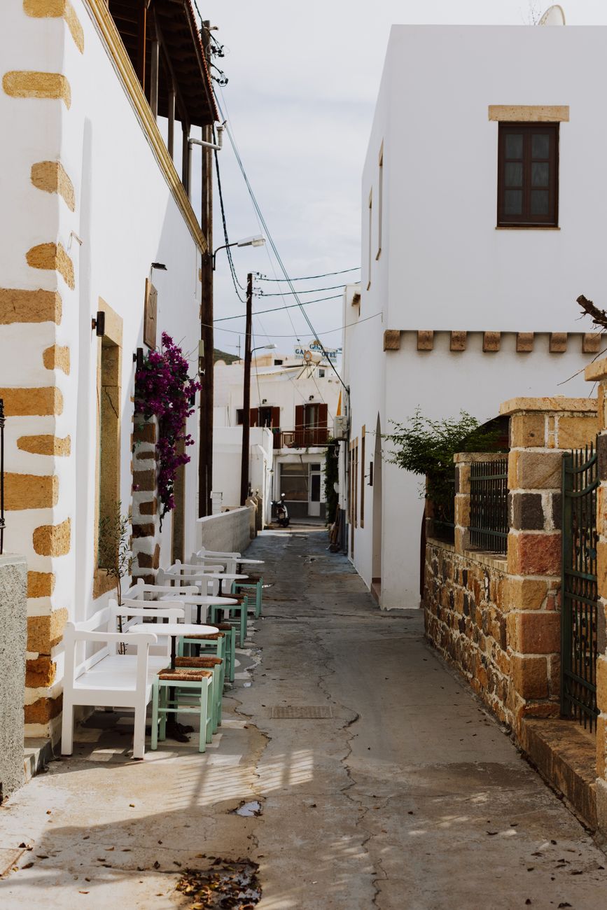 Narrow whitewashed alleyway in Chora Patmos with traditional Aegean architecture