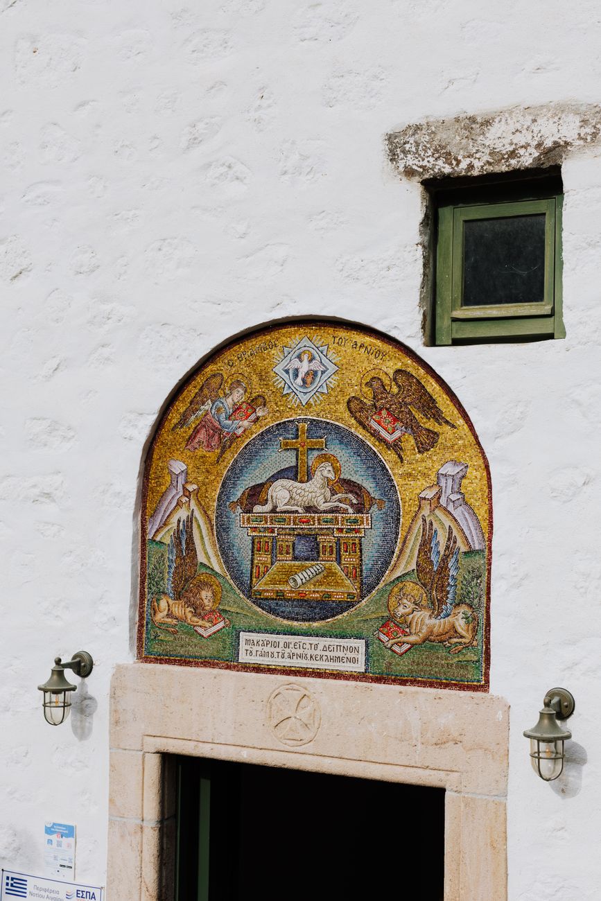 Colourful religious mosaic artwork above a doorway on Patmos island Greece