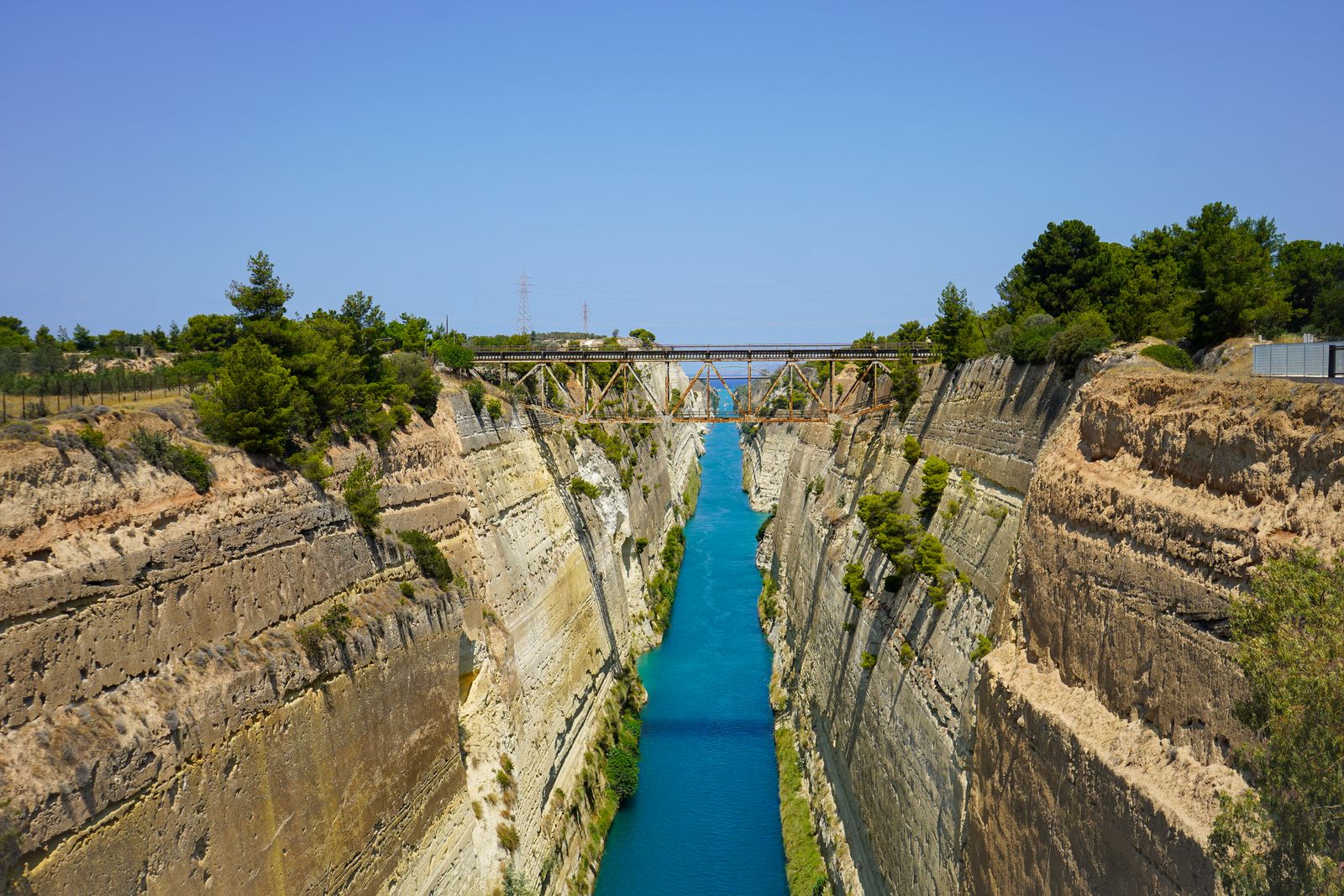 Aerial view of the Corinth Canal cutting through rocky cliffs in the Peloponnese, Greece