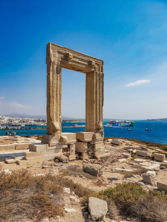 The ancient Portara marble gateway on the islet of Palatia overlooking the Aegean Sea in Naxos, Greece