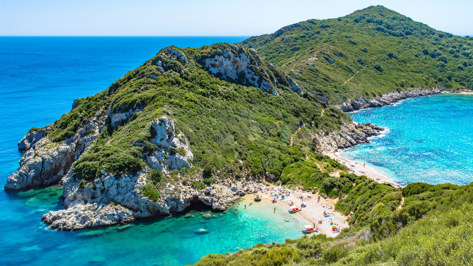 Porto Timoni double beach seen from above with turquoise water on both sides of a narrow spit near Afionas, Corfu