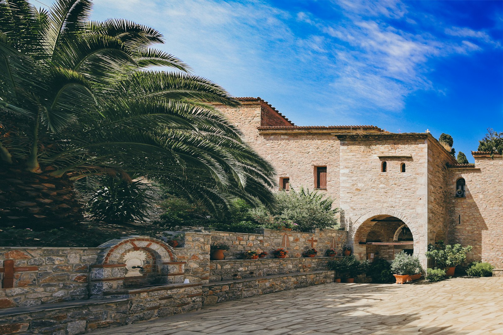 The Evangelistria Monastery set among pine trees on a hillside above Skiathos Town
